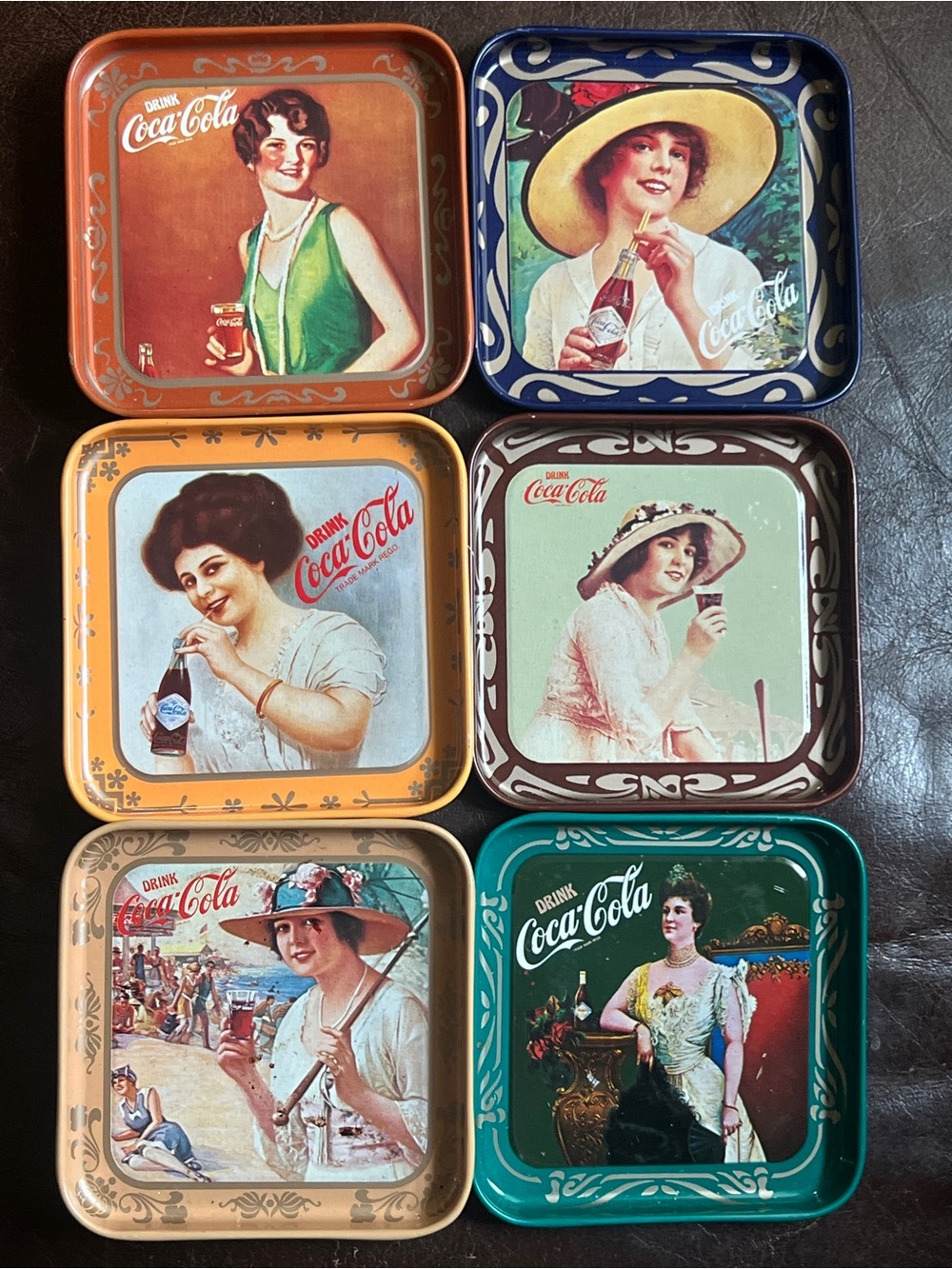 Coca-Cola Collectible Coasters in Orange, Blue, Yellow, Brown, Teal, Green